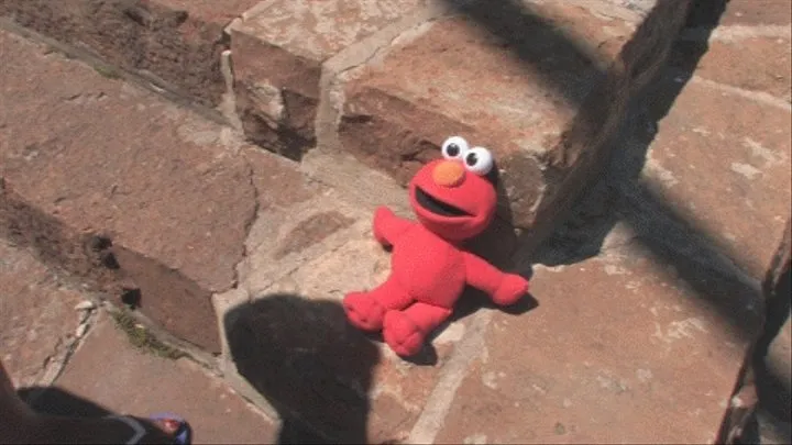 Crushing a stuffed Elmo