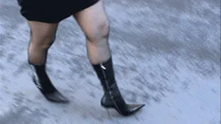 Walking in designer boots with metal high heels