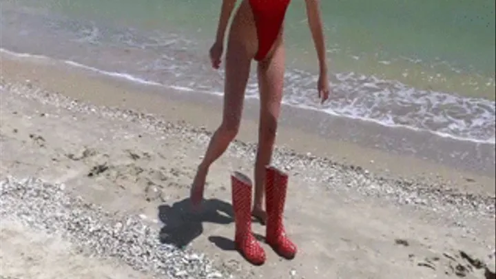 Sexy red swimswuit and rubber boots in the sea