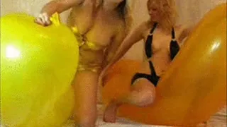 2 blondes deflating giant balloons -LQ