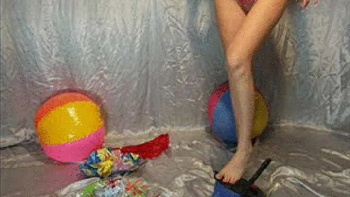 Alina inflates beachballs with a foot-pump -LQ