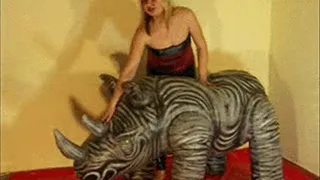 Christina rides a rhino in Spandex -LQ