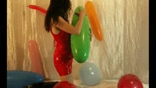 Jackie in Vinyldress plays with balloons