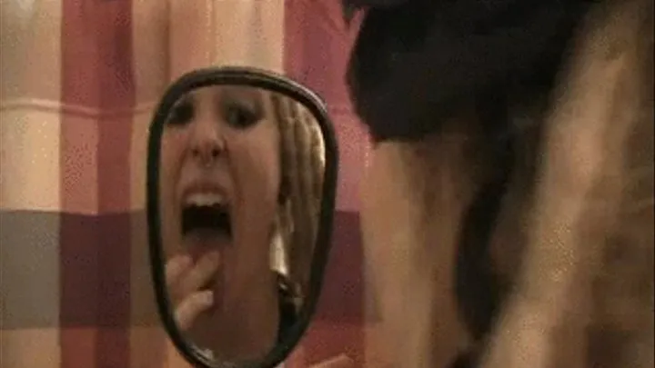 Lona examines her wide open mouth, teeth, tongue, and throat in a hand mirror * ***