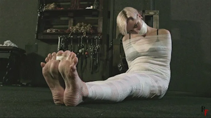 Barefoot Astrid gets mummified with white bandages and gagged tightly