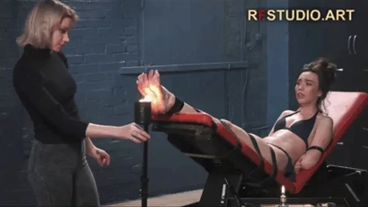 Astrid plays with Home Girl's feet using fire torch