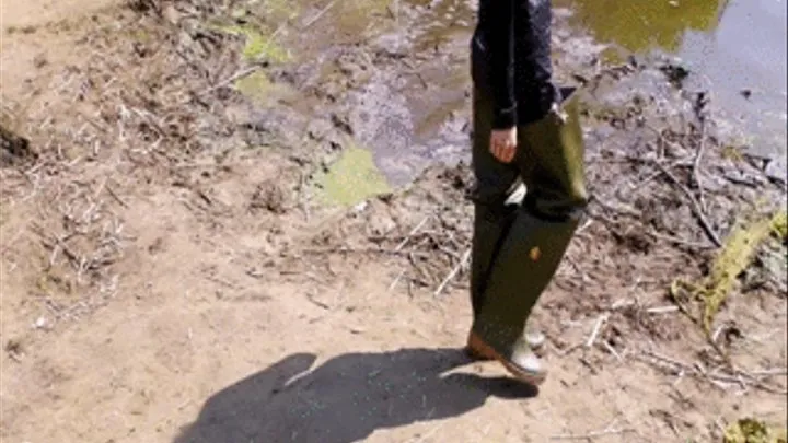 Christina and Jackie walking with Waders in a river