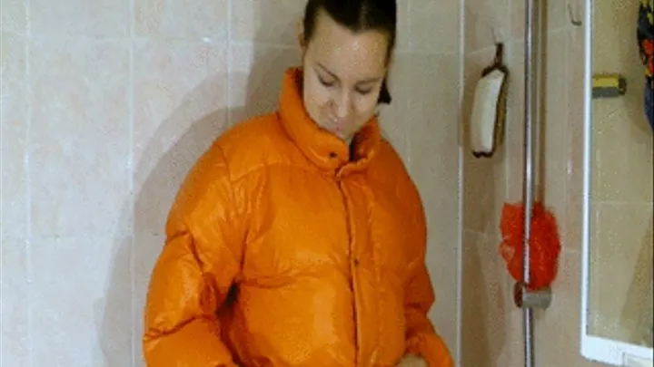 Jackie takes a shower in down jacket and shiny leggins