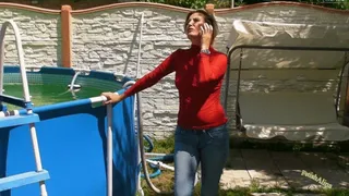 In Jeans and a Nylon Top in an outdoor Pool