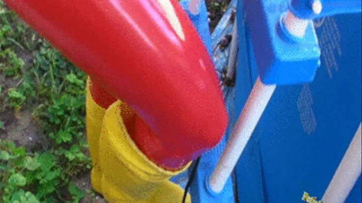 In Yellow wellies, red rubber leggins and down jacket pool cleaning