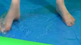 Playing fully dressed in an inflatable pool