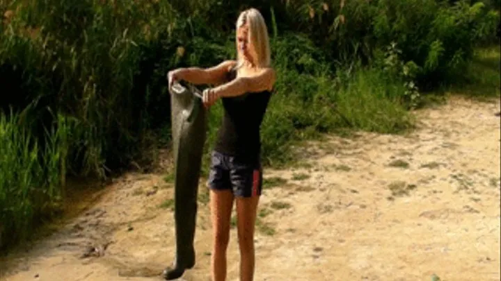 Christina outdoors in Waders walks in a river