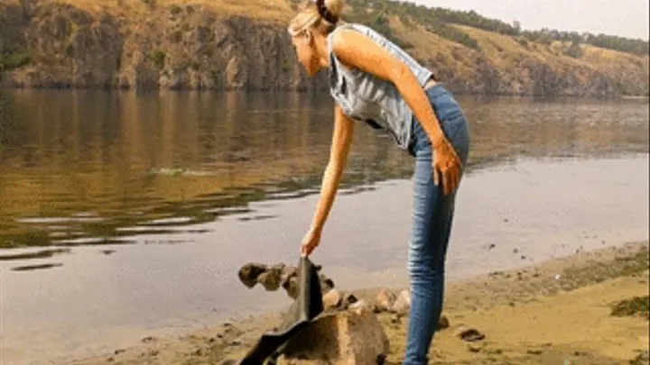 Christina outdoors in Waders and Jeans walks in a river