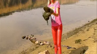 Alina is fishing in Waders in a river