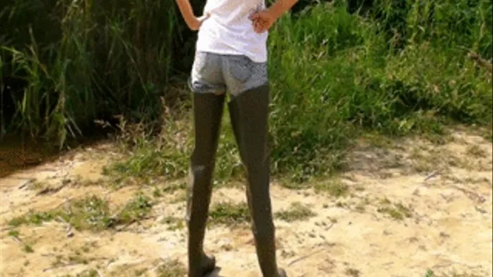 Alina outdoors in Waders walks in a river