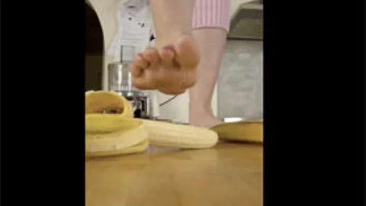 Crushing Banana With Bare Petite Feet