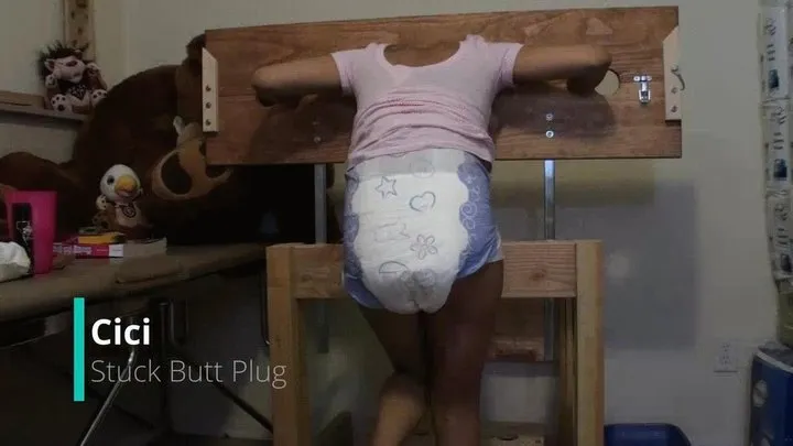 Cici: Stuck Butt Plug in Pillory