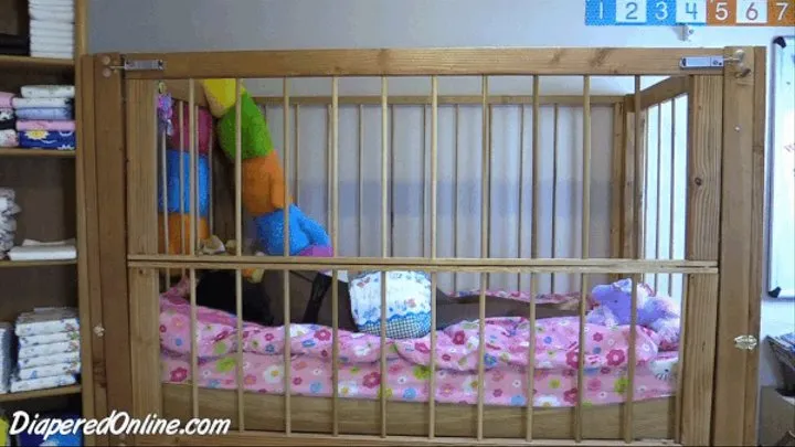 Iris: Messing in Crib