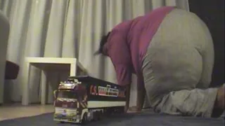 BBW giantess sits on semi truck