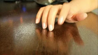 KNOCKING NAILS ON THE TABLE