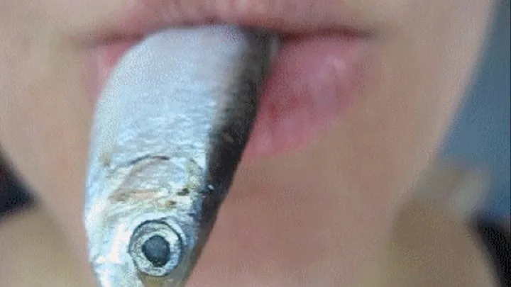 SMALL FISH IN THE MOUTH OF THE GIANTESS