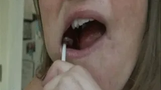 Mouth Fetish CHoping on a lolipop .... All stuck in my teeth pickin