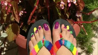 Relax in garden and enjoying feet and purple painted toenails