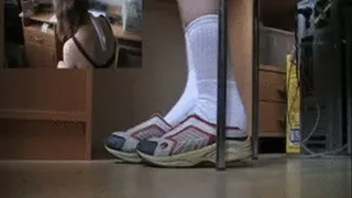 C 164 Young female office trainee in white socks and sneakers