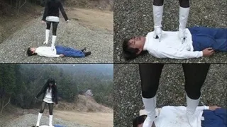 Man is lying on a rocky ground with domina stepping over his body - Full version ( - AVI Format)