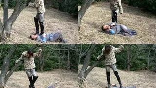 Domme in boots stands up on man's body in the woods - Full version ( - AVI Format)