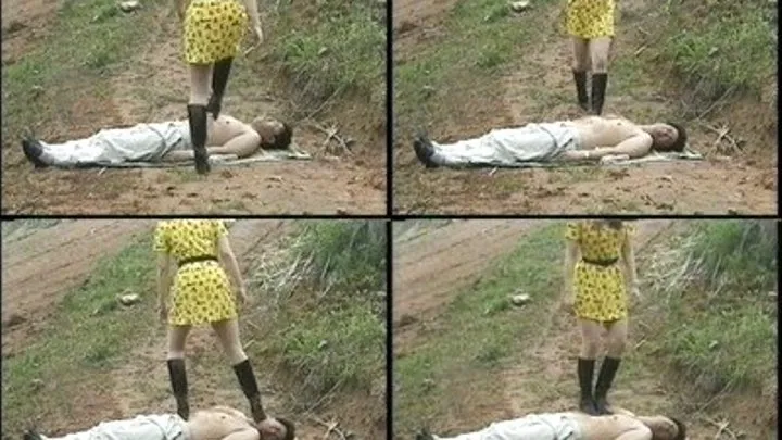 Man lies on the muddy ground as domina walks over his body - Full version ( - AVI Format)