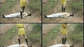 Man lies on the muddy ground as domina walks over his body - Full version ( - AVI Format)