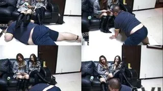 Two mistresses rest their feet in boots on man's back - Part 2 (Faster Download - ))