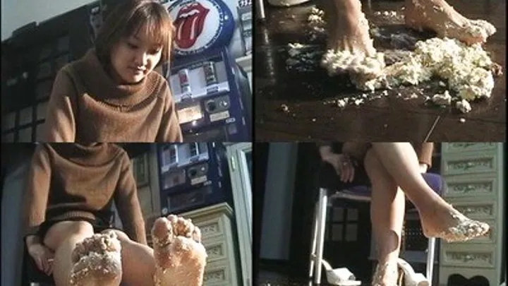 Lady mixes dough using her bare feet - - AVI Format