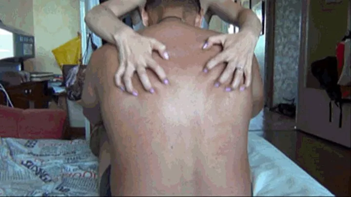 Man's back scratching