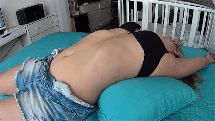 Women lie on the bed and stretch their bellies sa (B)