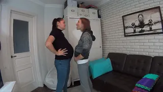 Pregnant women catball fight belly to belly and nose to nose