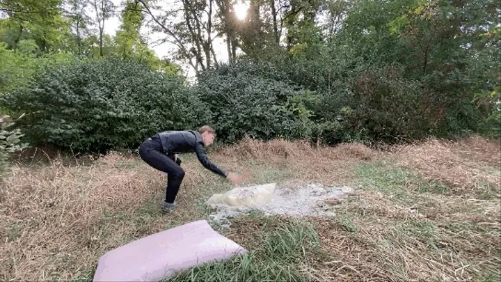 Destroying feather pillows with a rolling pin and ripping apart with hands