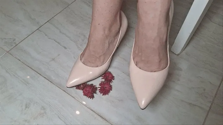 Toe tapping in high heeled shoes and crush flowers