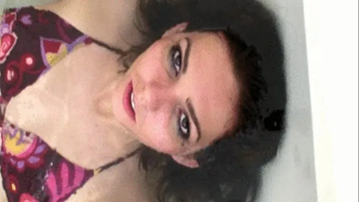 Dem posing underwater in the bath tub face close up.