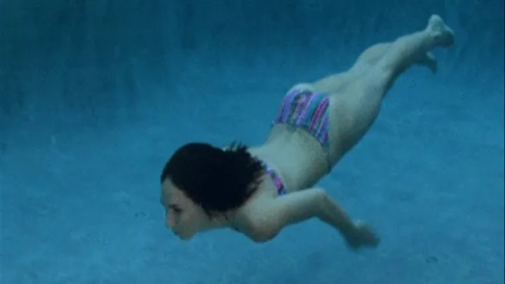 Dem showing off her swimming skills in the pool.