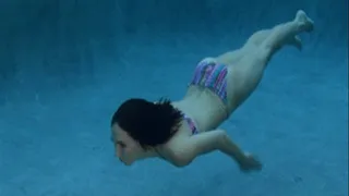 Dem showing off her swimming skills in the pool.