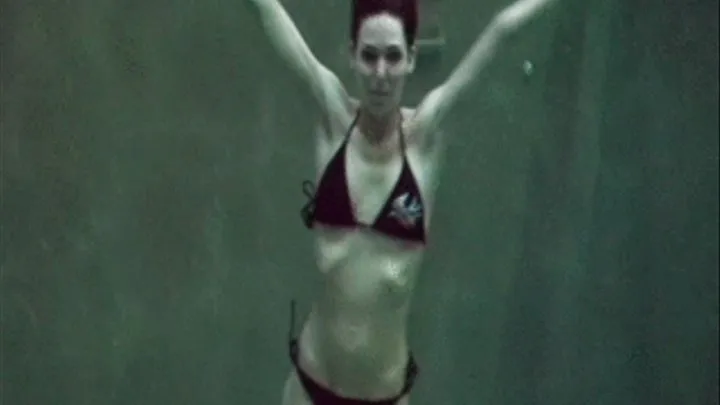 Dem swimming posing and walking underwater in slow motion.