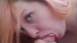 Redhead Danika swallows a stiff cock