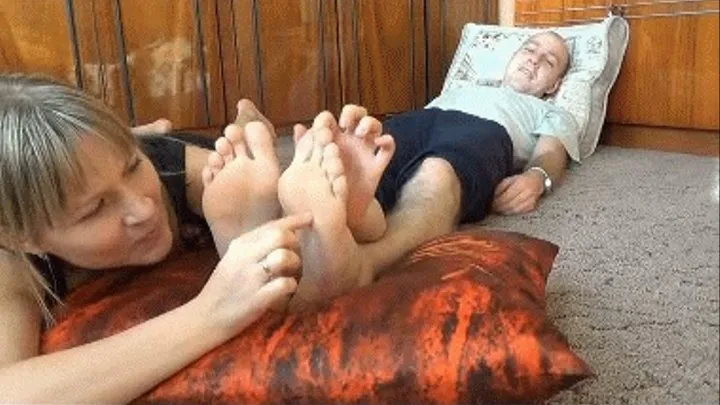 tickle biting his feet with (B)