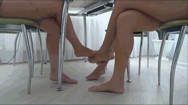 Footsie barefoot of 3 pairs beautiful legs under table TW