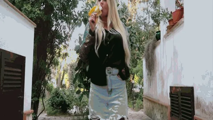 The blonde glides on the banana outside