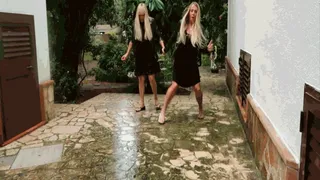 Two blondes slide like cows on ice