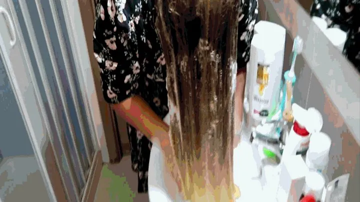 Sink, blond long hair and a lot of shampoo