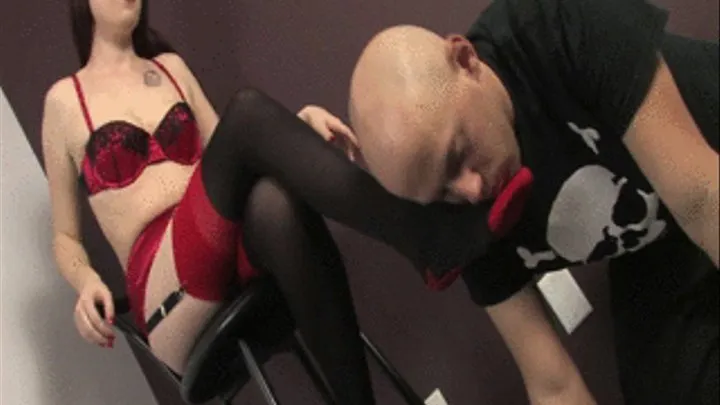 Mistress Tara sits high up on the stool and enjoys watching her stockings feet being licked clean by her slave boy